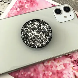 Universal folding phone grip with black base and glittering silver foil texture