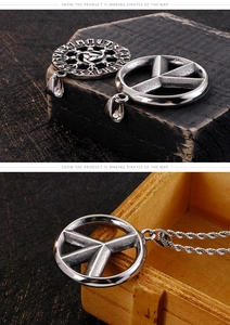 Detail of Viking Vegvisir and Peace Sign pendants on twisted chains with vintage silver finish