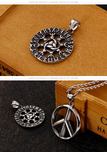 Macro shot of Viking runic and peace sign pendants with retro oxidized finish on chains