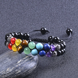Macro shot of double-row seven chakra stones with black onyx and adjustable braided cord