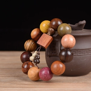 Close-up of 20MM mixed redwood beads bracelet with decorative square wooden plaque