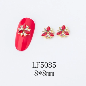 Macro detail of LF5085 red flower nail art charm with gold base and rhinestones, 8x8mm