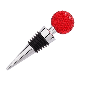 Detail shot of a red rhinestone crystal ball wine stopper with a silver metal base