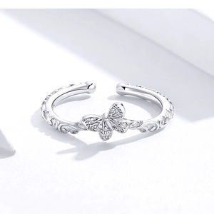 Macro shot of silver butterfly open ring with detailed metal texture and S925 engraving