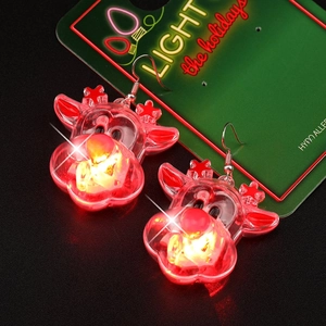 Close-up of glowing LED Christmas reindeer earrings with hypoallergenic metal hooks