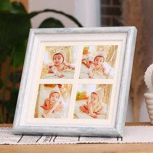 Vintage light blue textured wooden photo frame with four-grid opening for baby photos