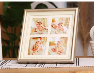 Detail of champagne gold four-opening photo frame with decorative beaded inner edge