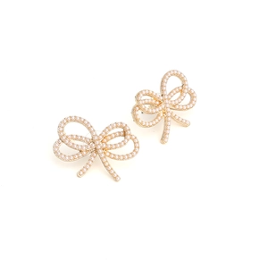 Elegant gold bow earrings with pearl inlay on white background for women jewelry