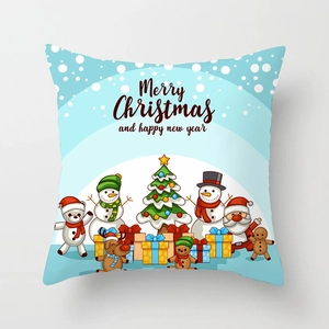 Detailed close-up of Merry Christmas festive pillow cover with cartoon Santa and snowman prints