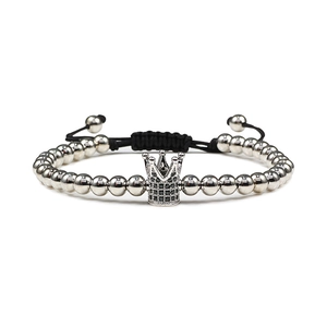 Handmade woven bracelet featuring silver crown charm with micro-p鑲 black stones