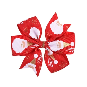 Red Christmas bow hair clip with Santa Claus and snowflake prints for festive girls