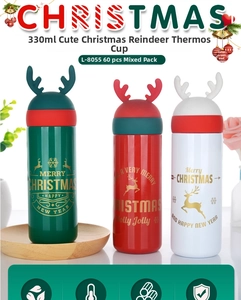 Close-up of 330ml Christmas reindeer insulated cups with soft silicone antlers and festive patterns
