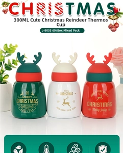 Close-up of 300ml Christmas reindeer insulated tumblers in green, white and red colors