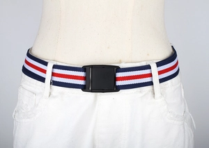 Close-up of red, white and blue striped elastic belt with black plastic buckle on pants