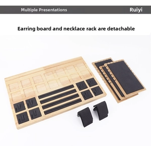 Macro shot of detachable light wood jewelry display kit with black velvet padding inserts