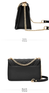 Detail view of the quilted texture, gold chain strap, and functional side compartments
