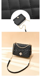 Detail of black quilted leather texture and gold metal chain strap on fashion handbag