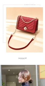 Detail of red quilted crossbody bag with gold chain strap and metal turn-lock closure