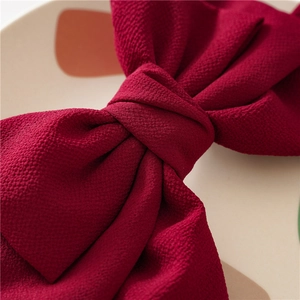 Three-layer wine red fabric bow hair clip with textured fabric for elegant women