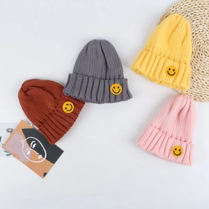 Kids Knitted Beanie Acrylic Warm Winter Hat With Smile Patch Ribbed Cuffed Cap For Boys And Girls