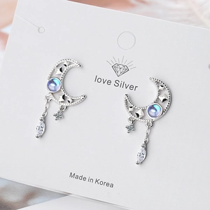 Delicate silver moon earrings with blue iridescent stones and star drop zircon dangles