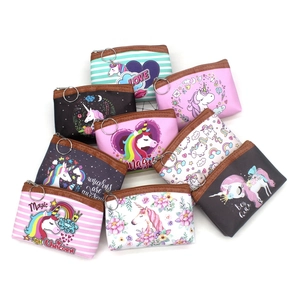 Collection of colorful cartoon unicorn coin purses with zippers and metal keychains