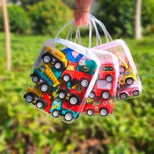 Three transparent bags filled with colorful plastic toy construction and rescue vehicles