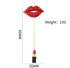 Detail view showing red rhinestone lipstick brooch dimensions 95mm by 35mm on gold base