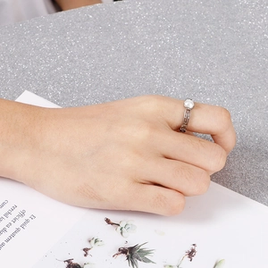 Minimalist silver safety pin pearl ring for women featuring a sleek paperclip chain design