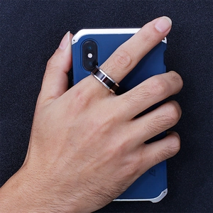 Men's silver and black stainless steel ring with wood grain inlay on hand