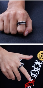 Detail showing two hand views of a men's stainless steel ring with dark wood grain inlay