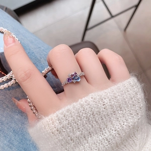 Close-up of elegant floral ring with multi-color pear-cut zircons on a model hand