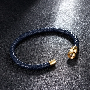 Navy blue braided leather bracelet with a polished gold magnetic buckle for men