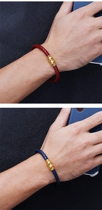 Detail of woven leather bracelet with gold magnetic clasp in red and blue styles