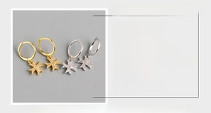 Detail of S925 sterling silver cross hoop earrings in gold and silver finish