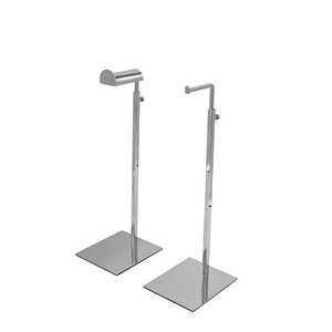 Detail of adjustable metal handbag display stands with arc and L-shaped hooks and square base