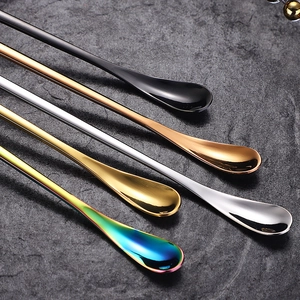 Five long-handled stainless steel stirring spoons in black, rose gold, gold, silver and rainbow