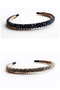 Detail view of handmade beaded headbands with dark blue and champagne crystal beads