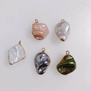 Macro view of five-color baroque irregular pearls with gold edges for DIY jewelry making