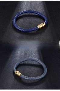 Detail of woven leather bracelets in deep blue and gray-blue with gold magnetic clasps