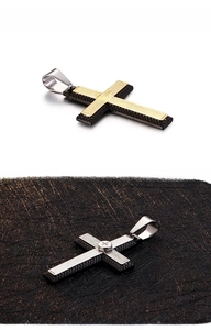 Detail of industrial two-tone cross pendant with screw accent and textured finish