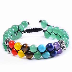Detailed macro view of seven chakra double-layer woven bead bracelet with colorful stones