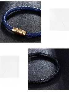 Detail of woven leather bracelet with 18K gold plated buckle in black and blue