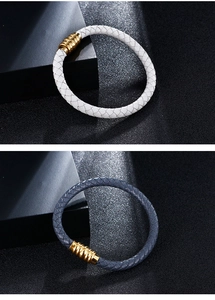Macro detail of microfiber leather bracelets with golden spiral texture metal buckles