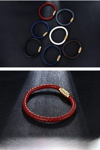 Macro detail of red braided leather bracelet with textured 18K gold magnetic clasp