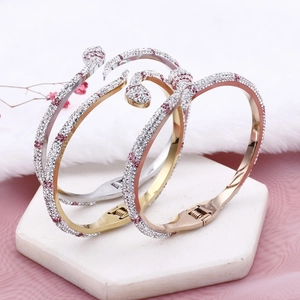 Bracelets serpent en acier doré et argenté ornés de cristaux avec têtes de serpent