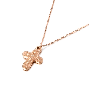 Minimalist rose gold cross necklace for women with embossed pendant on white background
