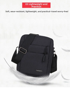 Detail view of the black canvas shoulder bag with main zipper and metal brand logo