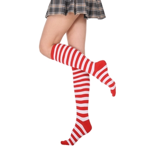 Detailed close-up of red and white striped over-the-knee socks in soft knit fabric
