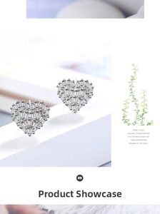 Close-up of heart-shaped silver earrings with sparkling cubic zirconia on a white stand